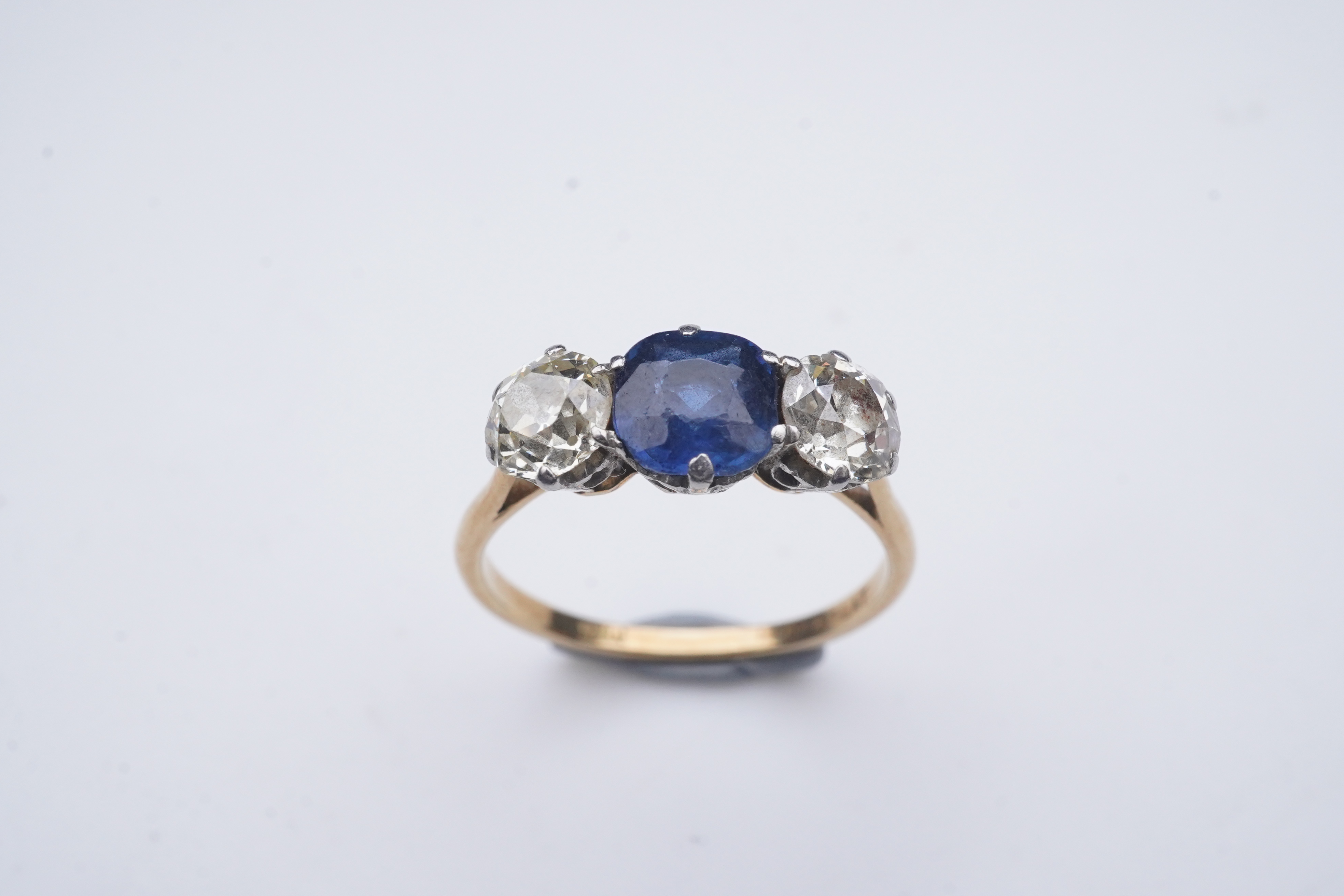 A sapphire and diamond three-stone ring, early 20th century